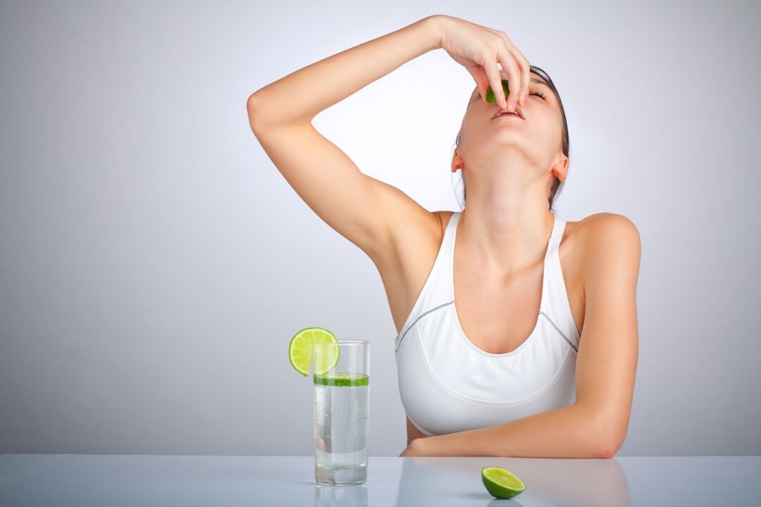 Girl drinks lemon water for weight loss